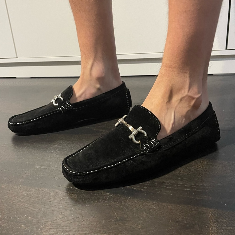Men’s loafer with metal detail and accent stitching.